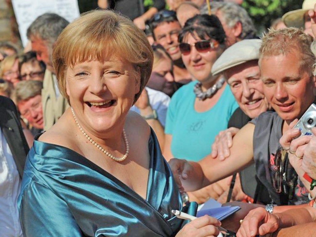 Angela Merkel has returned from holiday, during which she visited the Bayreuth festival