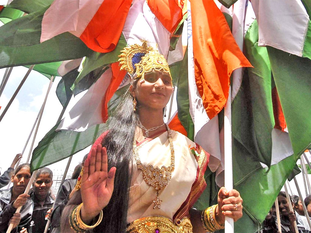 A woman dressed as Mother India during the country's Independence Day celebrations