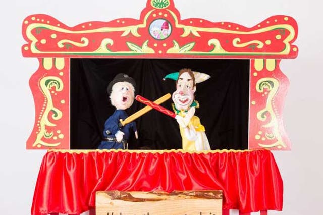 Boris Johnson (left) as a bumbling policeman and the Nick Clegg as 'Cleggy the Clown' in the modernised Punch and Judy show