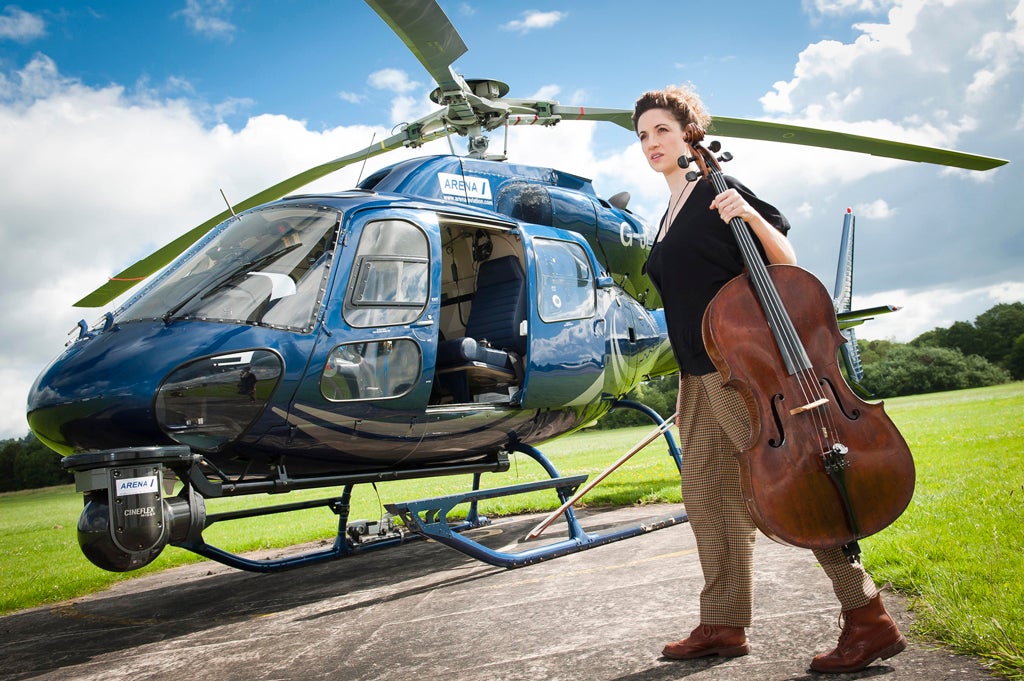 Laura Moody, cellist with Elysian String Quartet, with a helicopter