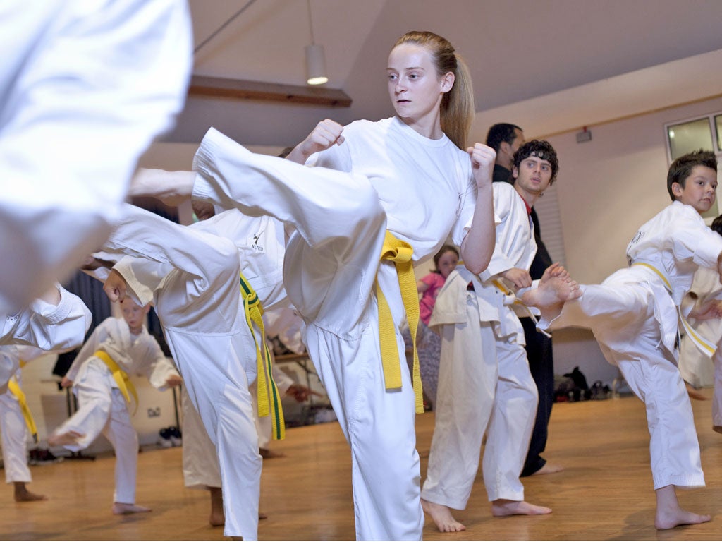 Chelsea Bland, 15 (with the yellow belt) and her Tae Kwon Do
class in Leytonstone, east London