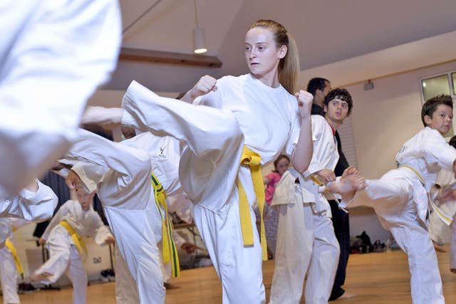 Chelsea Bland, 15 (with the yellow belt) and her Tae Kwon Do
class in Leytonstone, east London