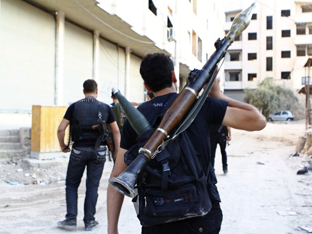 The Free Syrian Army secures a street in the Damascus suburb of Saqba