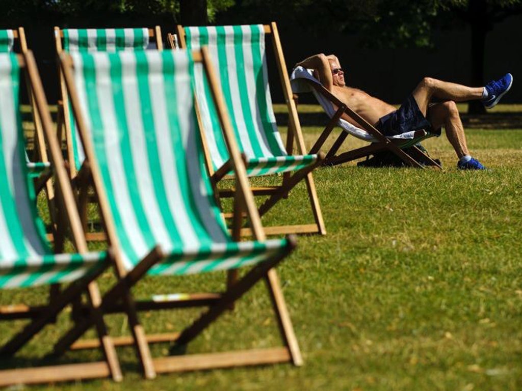 A man enjoys the sunshine in Hyde Park, London
