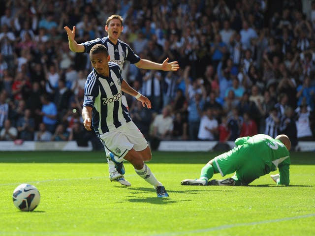 Peter Odemwingie of West Brom celebrates scoring their second goal from a penalty