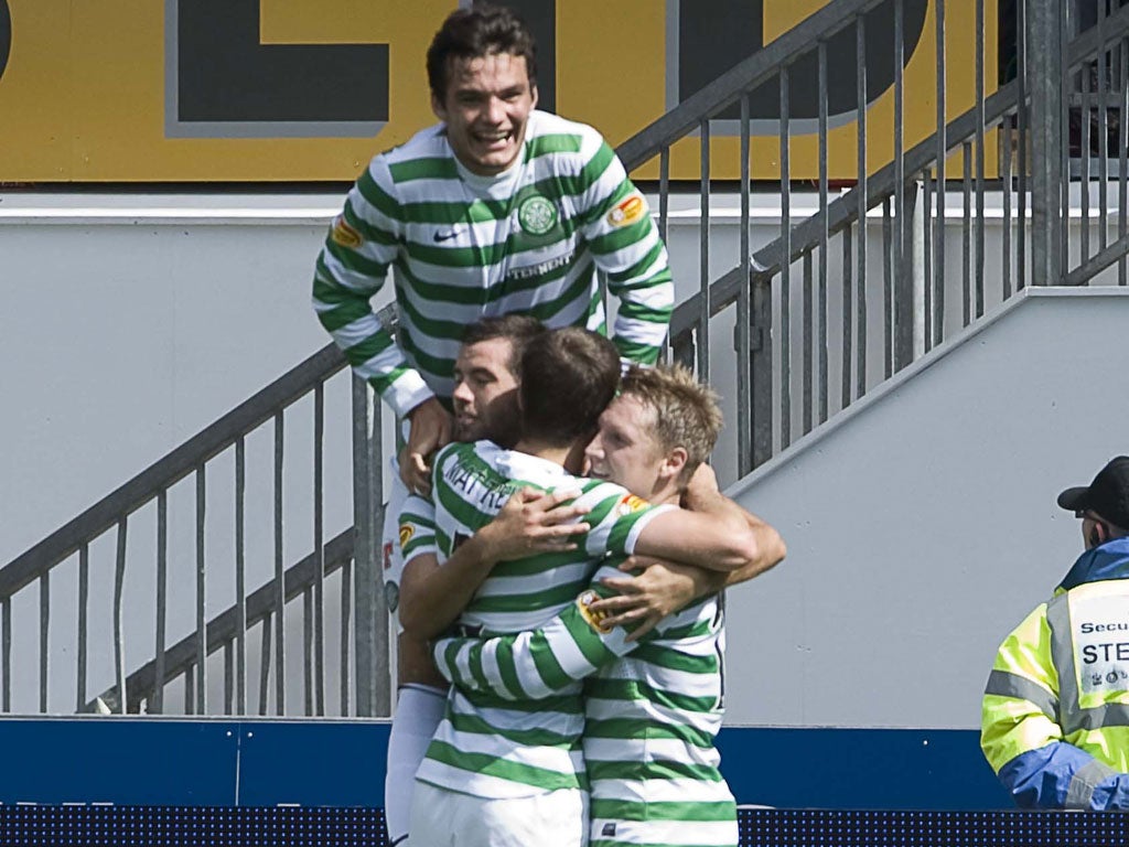 Jump for joy: Kris Commons (right) celebrates his last-gasp equaliser