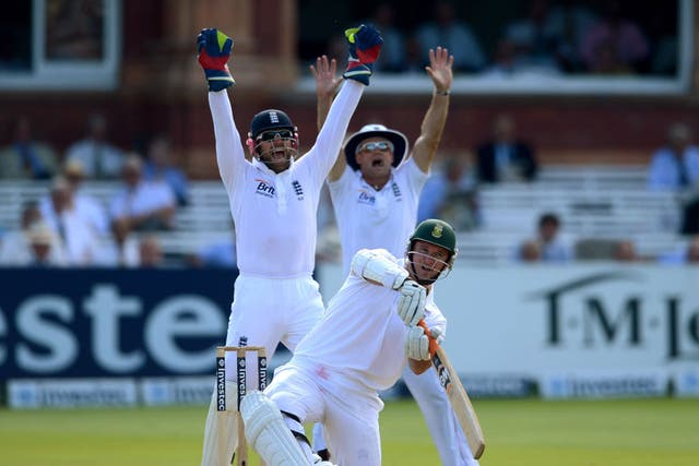 Heat is on: England's Matt Prior and Andrew Strauss successfully appeal for the wicket of Graeme Smith