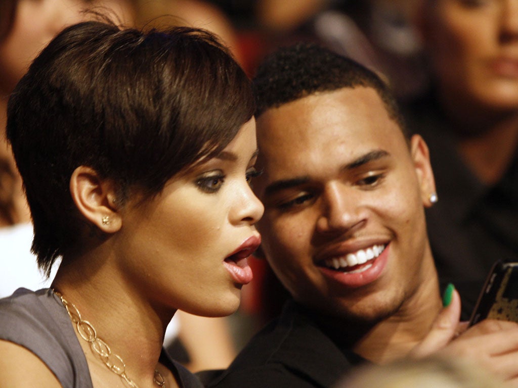 Forgiving: Rihanna with Chris Brown in 2008, before he attacked her