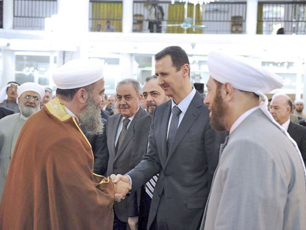 President Assad attending prayers at the al-Hamad mosque