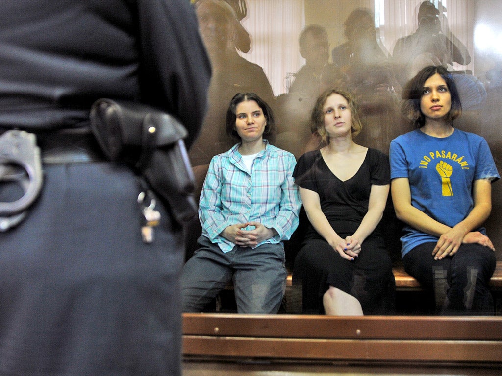 Pussy Riot's members await their fate during a court hearing in Moscow