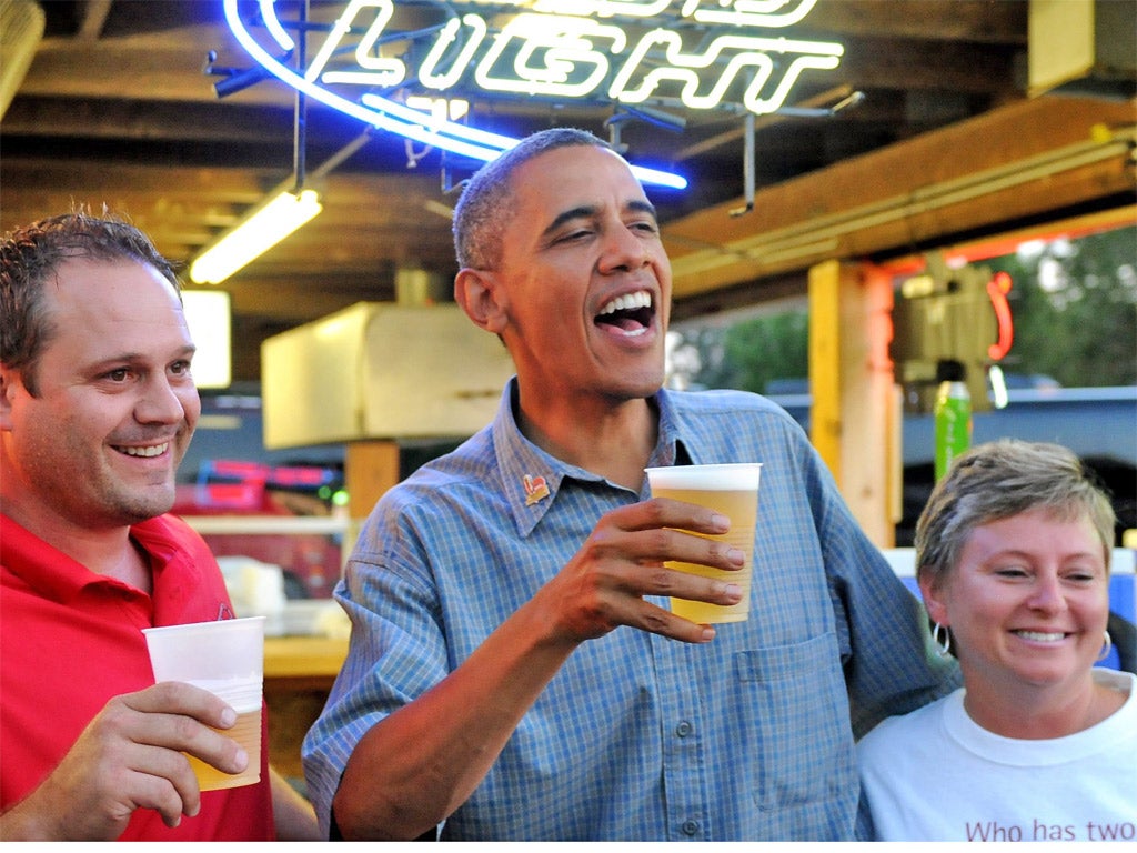 Barack Obama enjoying a beer with locals in Iowa earlier this month
