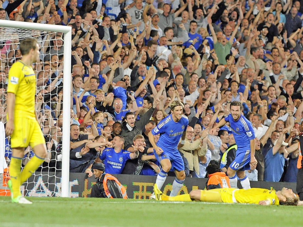 Fernando Torres celebrates scoring Chelsea's third goal with team-mate Juan Mata