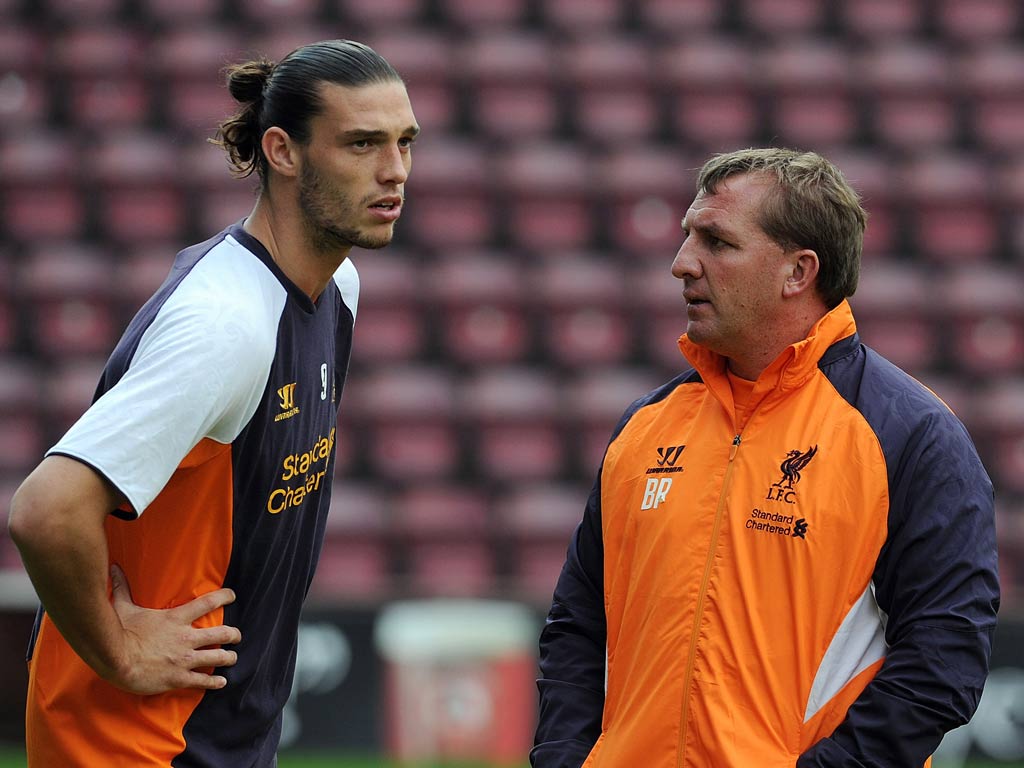 Brendan Rodgers talks with Andy Carroll
