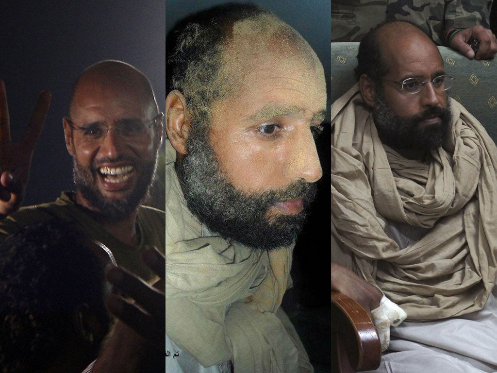 Changing fortunes: Saif al-Islam Gaddafi flashes the V-sign for victory in August last year, before his capture and detention by rebels
