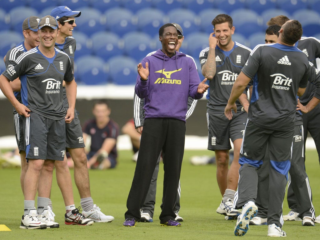 GB sprinter Christian Malcolm shares a joke with the England team yesterday