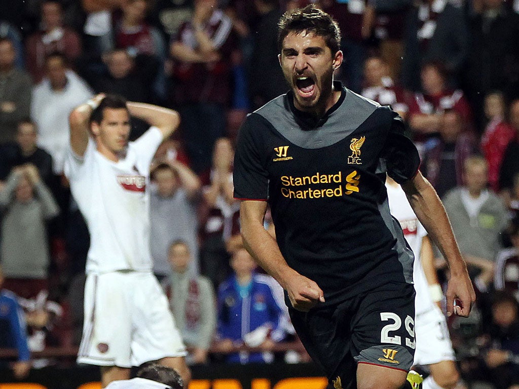 Fabio Borini wheels away in delight after Andy Webster's own-goal gave Liverpool the lead