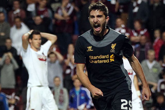 Fabio Borini wheels away in delight after Andy Webster's own-goal gave Liverpool the lead