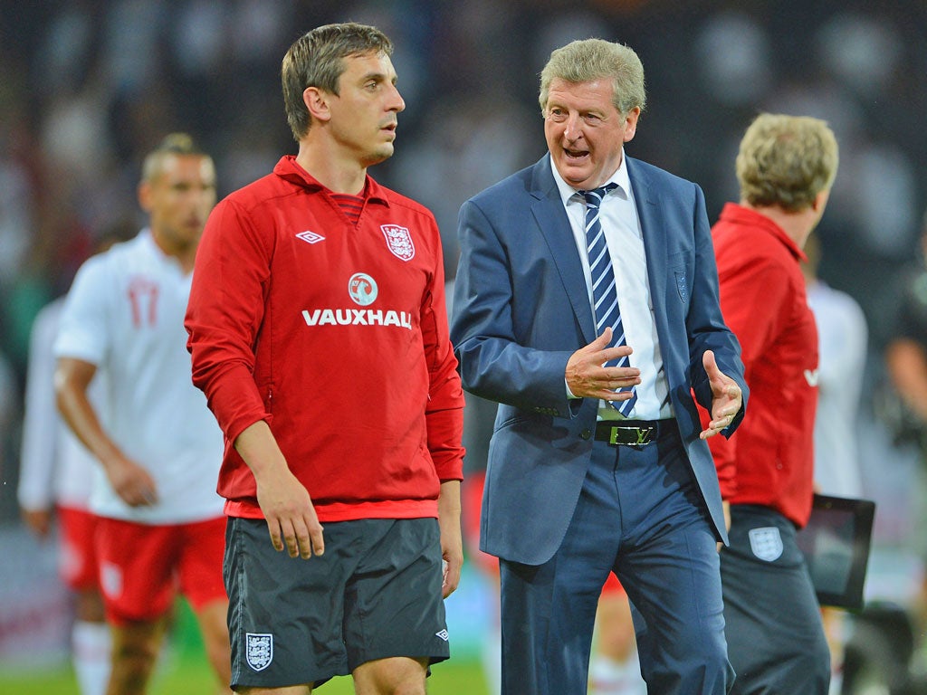 Roy Hodgson in discussion with Gary Neville after the recent
friendly against Italy