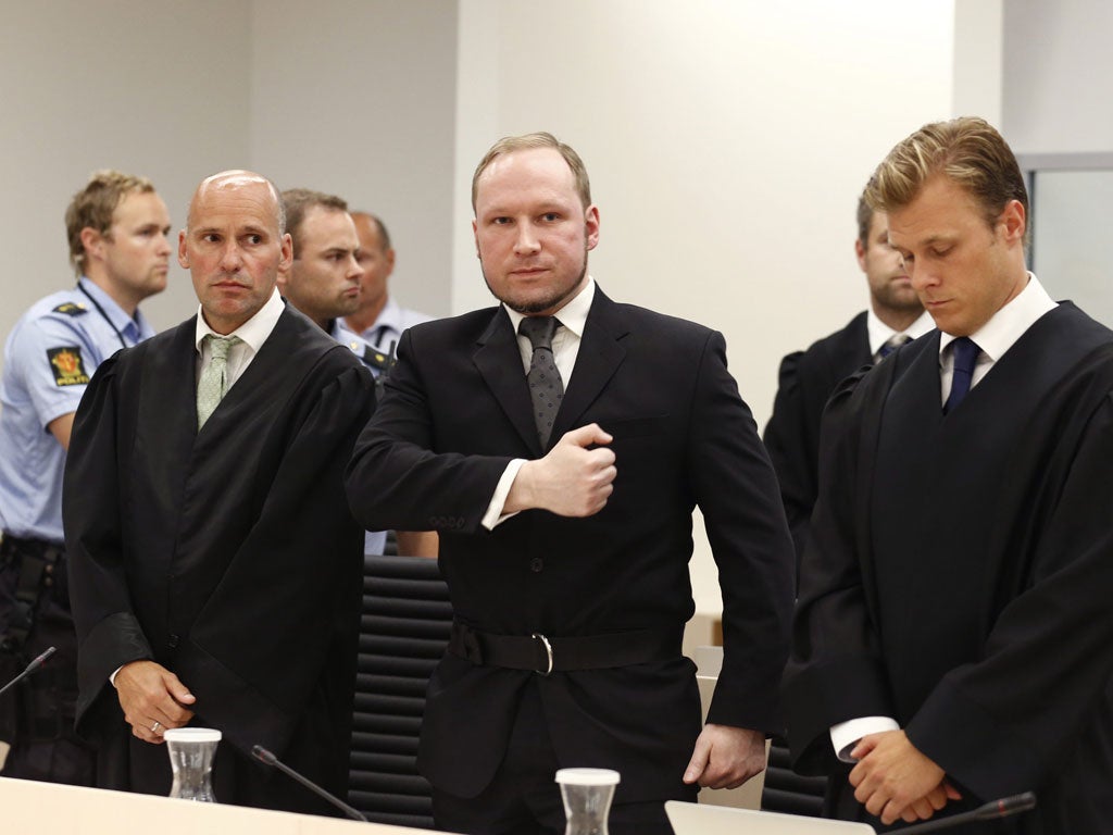 Accompanied by his defence lawyers, Anders Behring Breivik arrives in court to hear the verdict yesterday