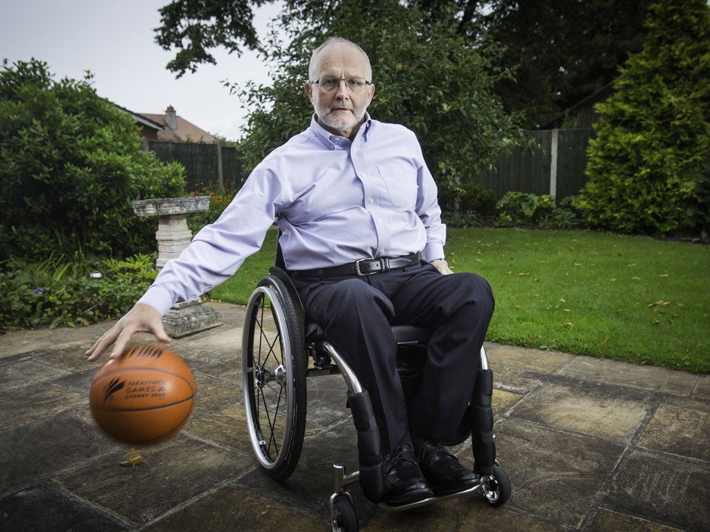 Fast hands: At home in his garden Sir Philip dribbles a ball around his chair with dizzying speed