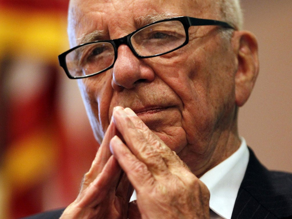 Murdoch: saw initial failure to run the photos as 'humiliating'