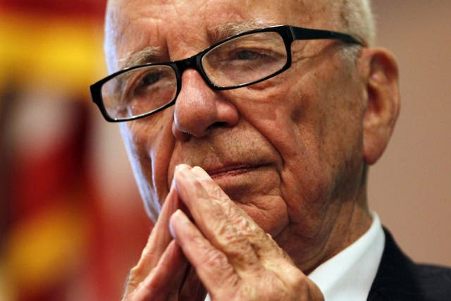 Murdoch: saw initial failure to run the photos as 'humiliating'