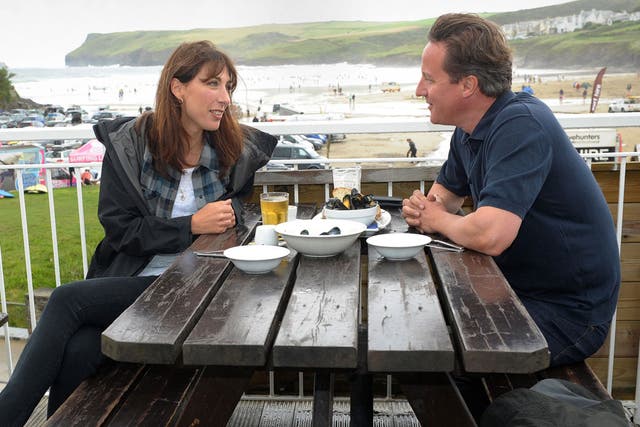 Mussel beach: David Cameron and his wife Samantha have lunch by the sea at Polzeath, Cornwall, yesterday