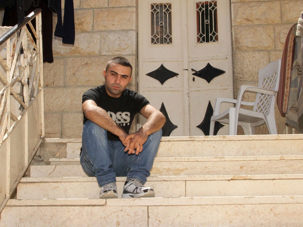 Scarred: Hafez Rajabi, 21, was beaten in 2007 by soldiers