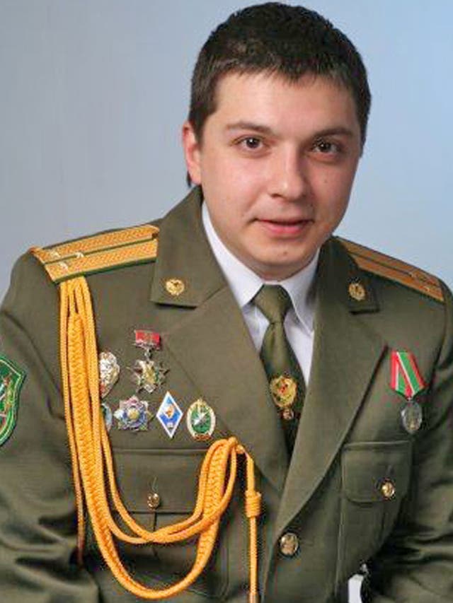Aliaksandr Barankov poses in his Belarus military uniform