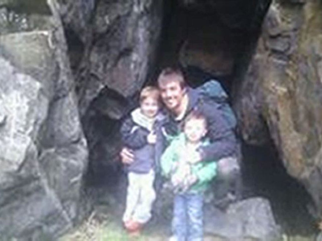 Ewen Beaton, five, left and his two-year-old brother, Jamie, with their father Ewen Fraser, whose body is still missing