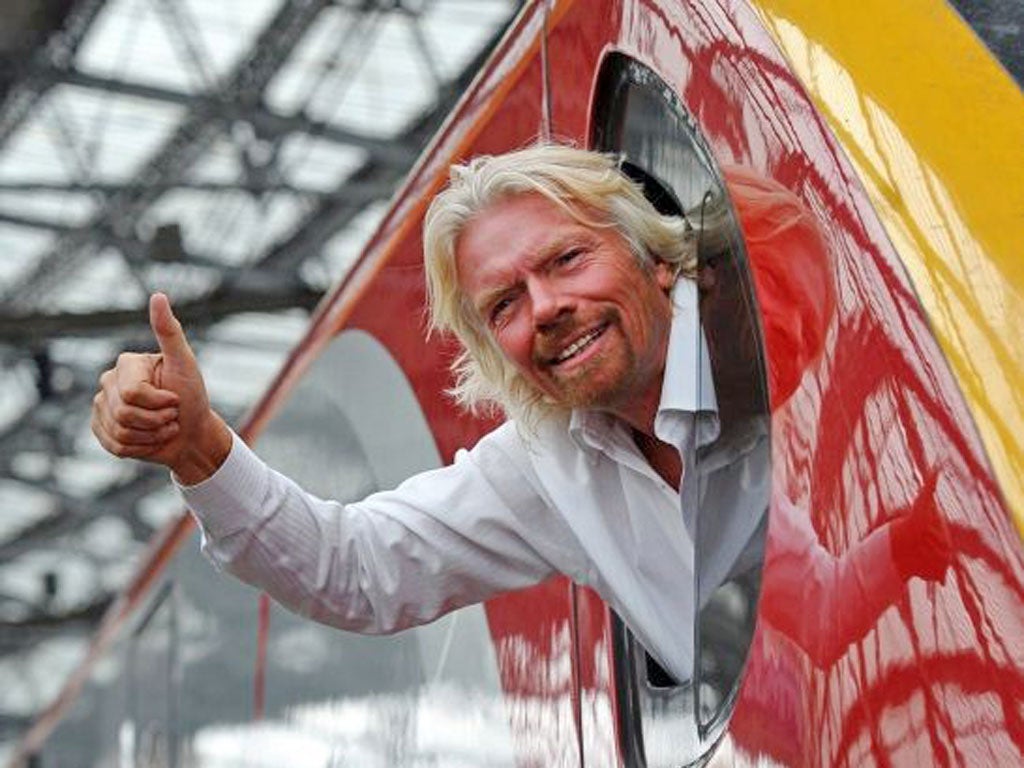Richard Branson wants the train deal postponed for a month until after the summer holidays