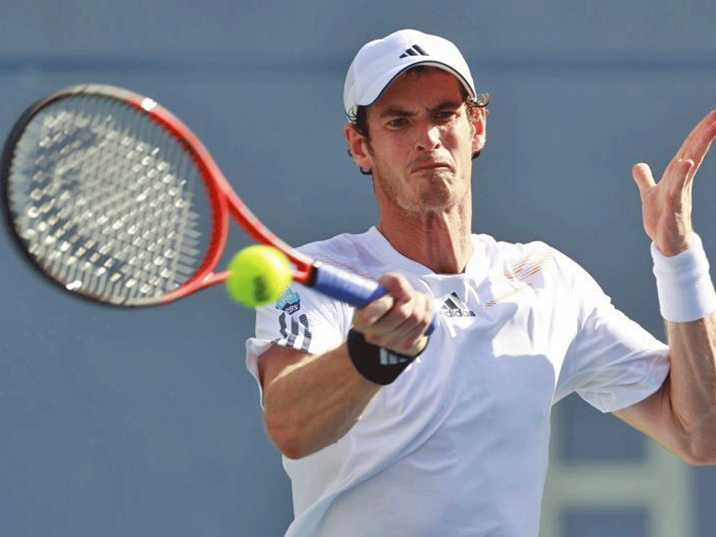 Andy Murray gets in a backhand return on his way to victory over the Russian Alex