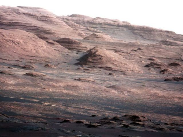 The images detail a mound of layered rock where scientists plan to focus their search for the chemical ingredients of life on the Red Planet