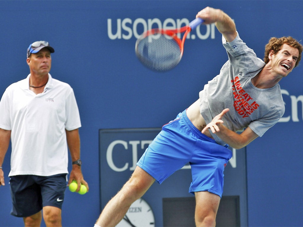 Andy Murray practises watched by his coach Ivan Lendl