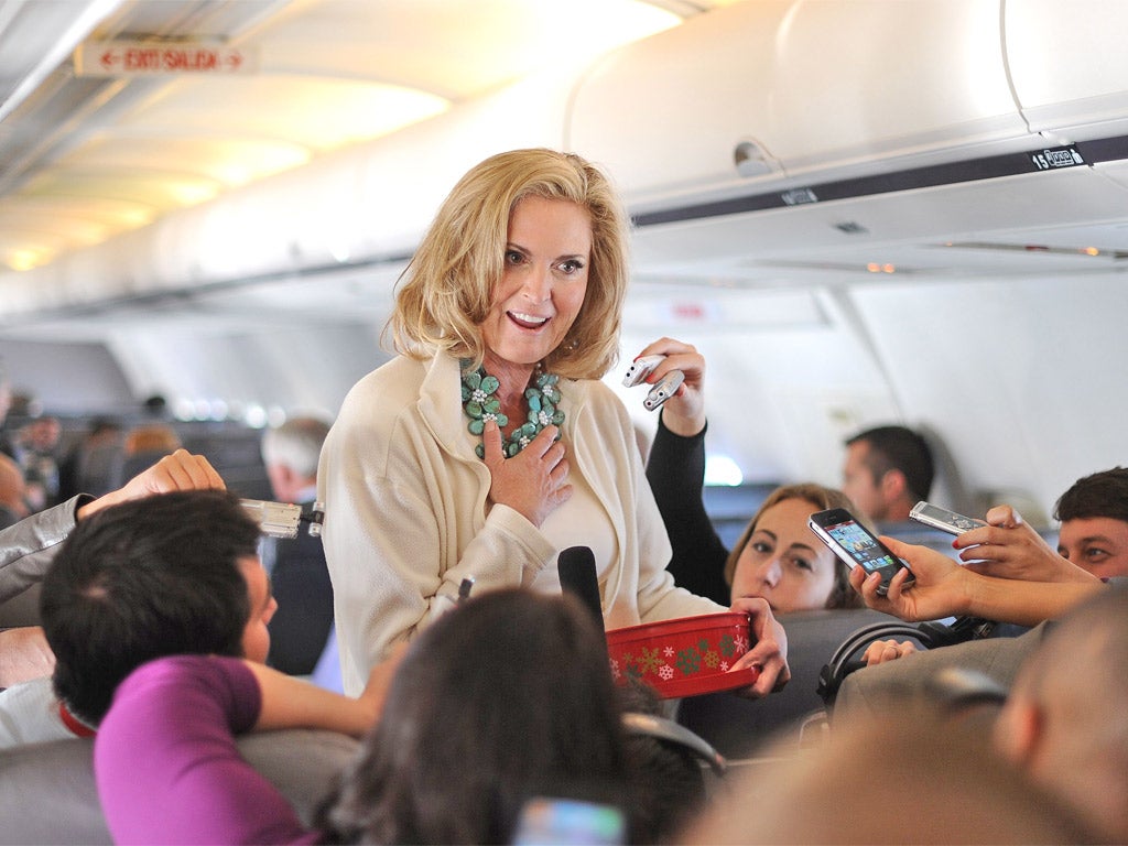 Ann Romney meets the press on the campaign flight to Tampa: she also gave them biscuits