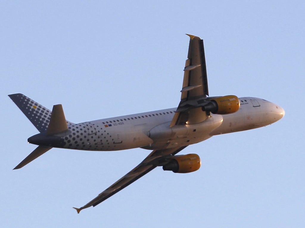 A jet in the livery of the low-cost airline Vueling