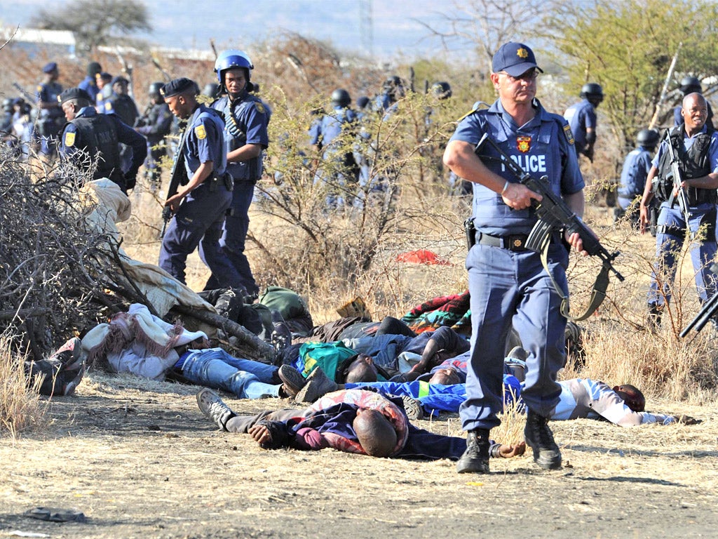 Police at the scene of the Lonmin mine massacre earlier this month