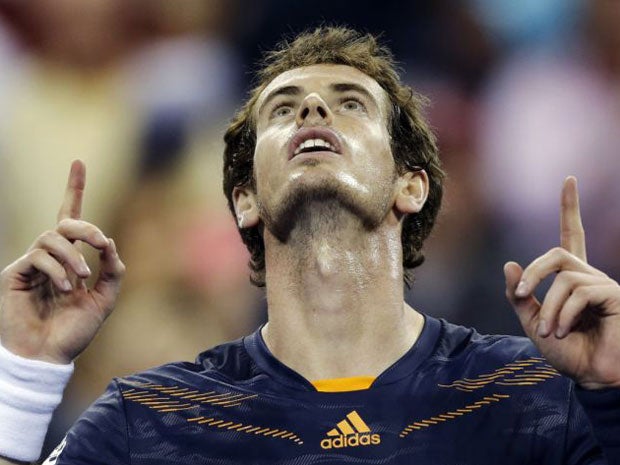 Andy Murray celebrates his 6-2, 6-1, 6-3, win over Ivan Dodig