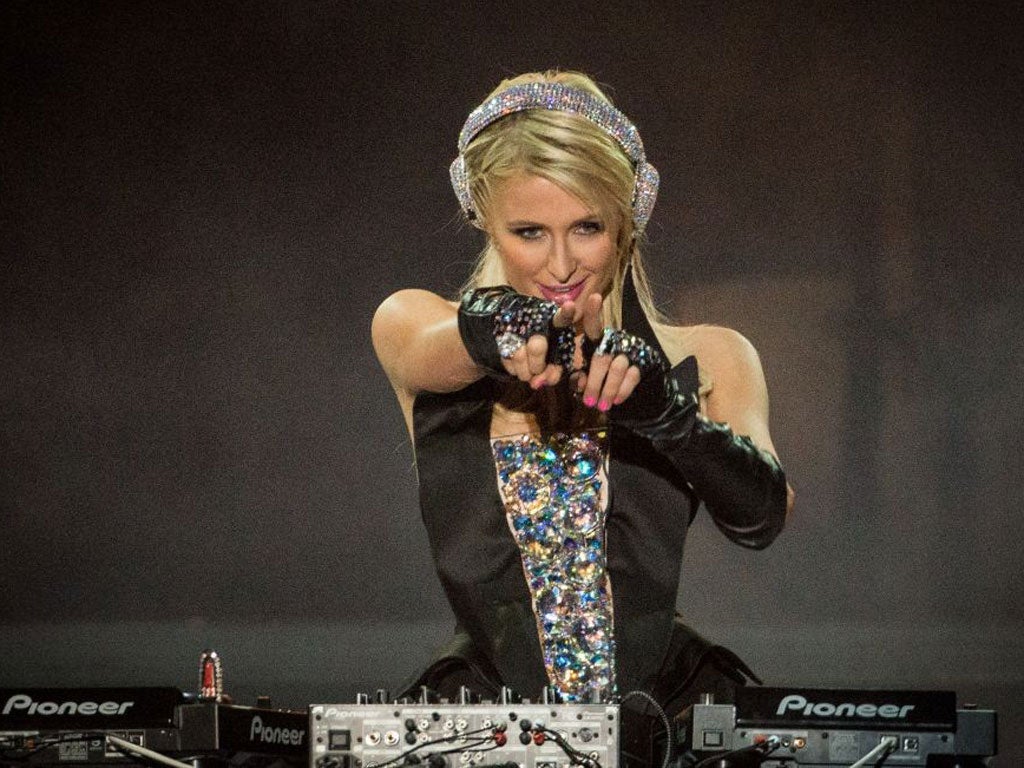 Needle time: Socialite Paris Hilton tries to find the groove 