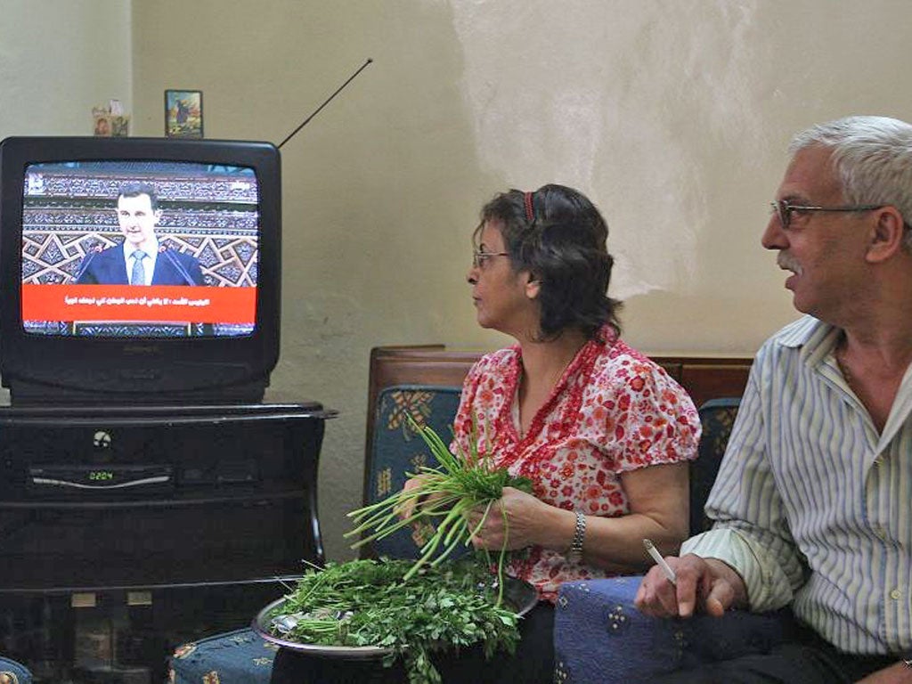 Minister Omran Zoubi controls how Syrians see their President and how the civil war is portrayed