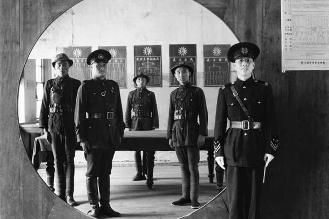 The assistant chief of police and his staff at headquarters in Chengtu, China, 1944