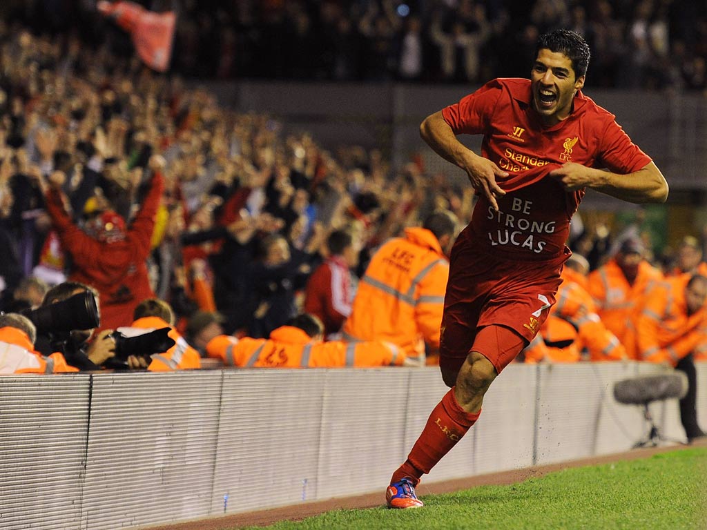 Luis Suarez celebrates after his goal against Hearts ensured Liverpool qualified for the Europa League