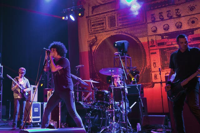 All friends again: Cedric Bixler-Zavala and co meet up for a long-anticipated reunion at the Academy in Brixton