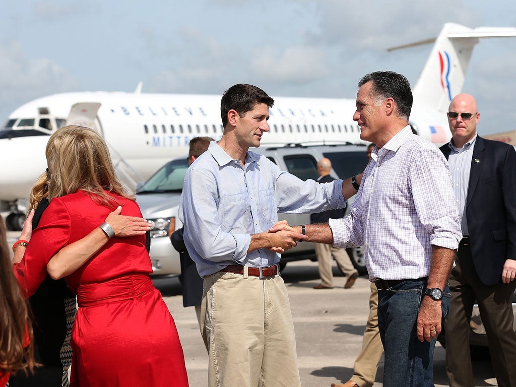 Romney, centre right, with his running mate Paul Ryan in Lakeland, Florida, yesterday