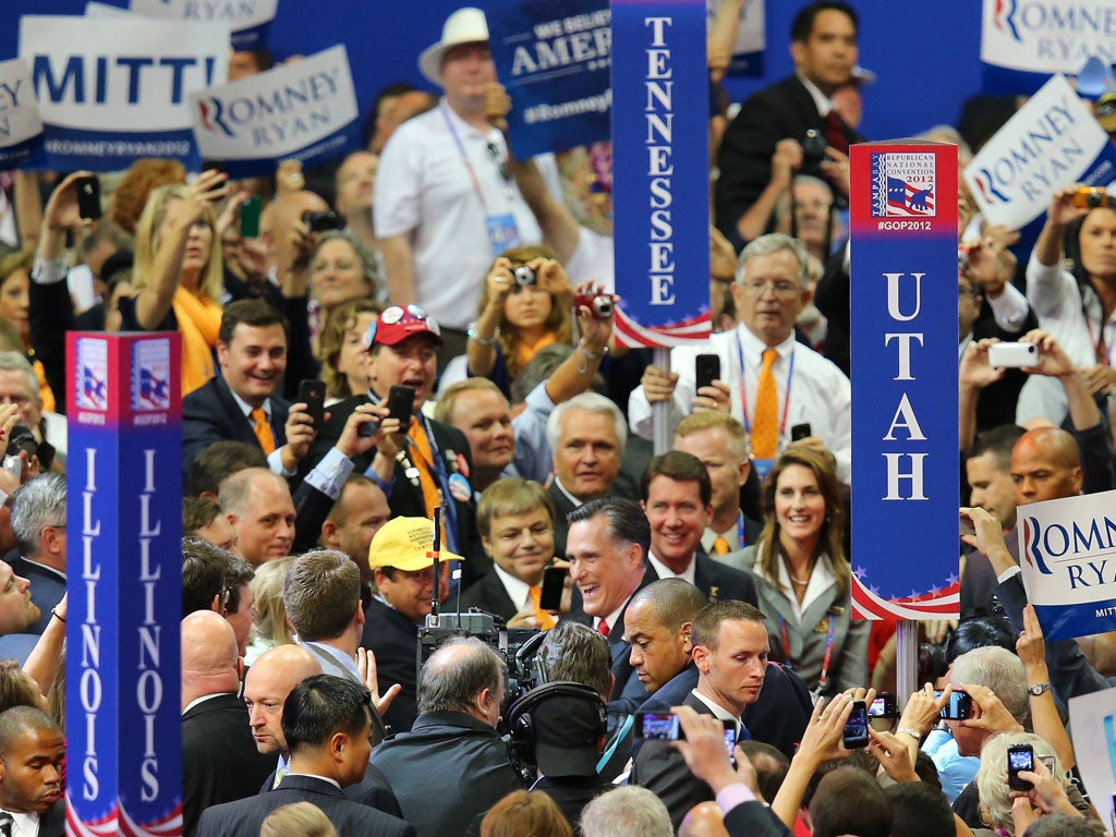 Mitt Romney is surrounded by the Republican faithful in Tampa