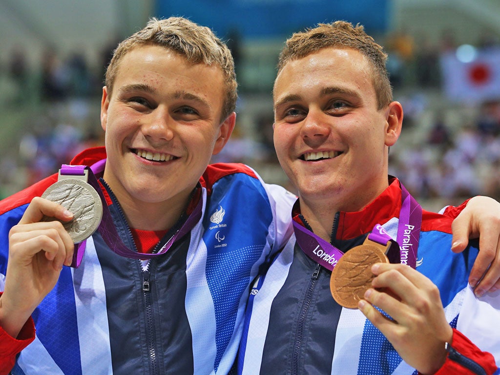 Great Britain's Oliver Hynd (left) and Sam Hynd pose with their silver and bronze medals