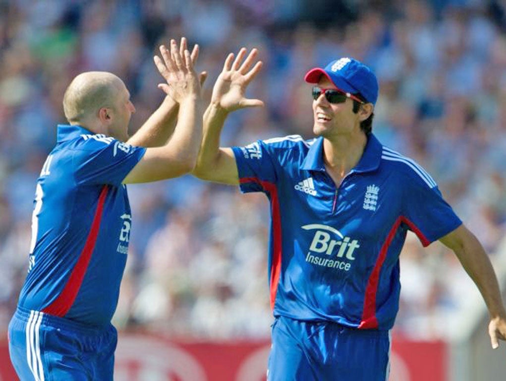 Double-handed: Alastair Cook (right) congratulates James Tredwell on the way to his first win as dual-format captain