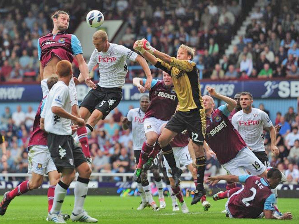 Andy Carroll rises for a header before he is injured