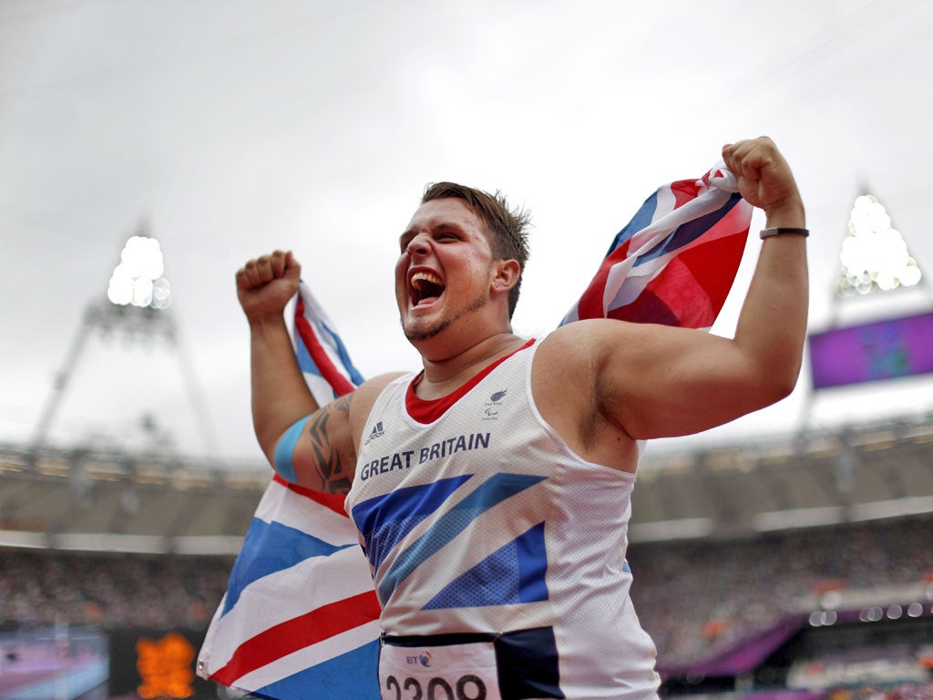 Great Britain's Aled Davies enjoys his moment of triumph in the discus yesterday