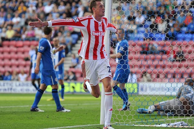 Stoke striker Peter Crouch celebrates a goal against Wigan